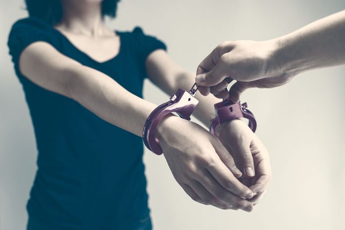 Handcuffed woman